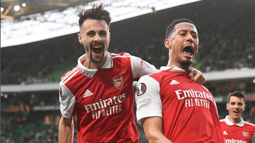 English Premier League leaders Arsenal were held to 2-2 draw by the Portuguese Sporting Lisbon in the UEFA Europa League first leg of the round of 16 in Lisbon