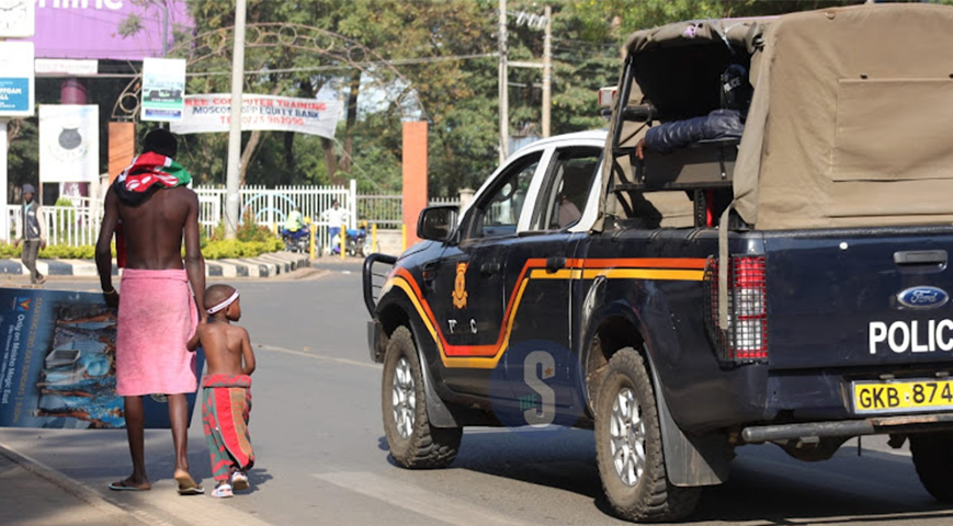 Kisumu man and son show up for demos in a towel