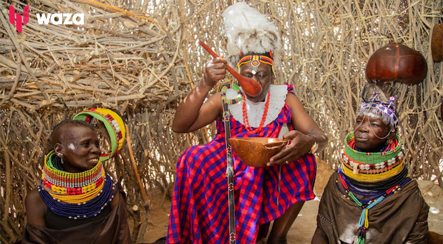 Ruto drinks porridge from calabash at Turkana Festival