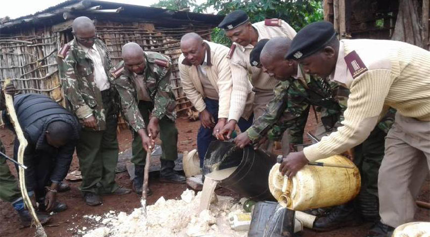 Police officers destroy over 1000 crates of illicit brew