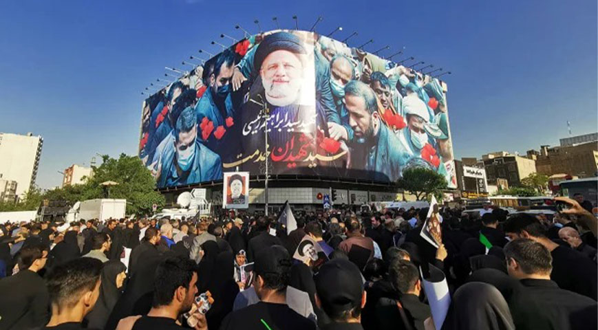 Thousands gather for the funeral procession of the late Iranian president Raisi